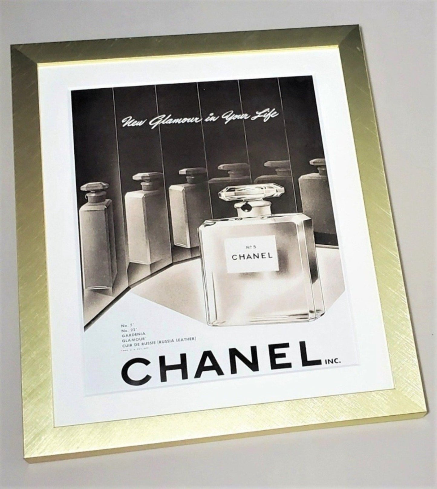 Chanel No 5 Bottle Framed In A Brushed Gold Metal Frame 