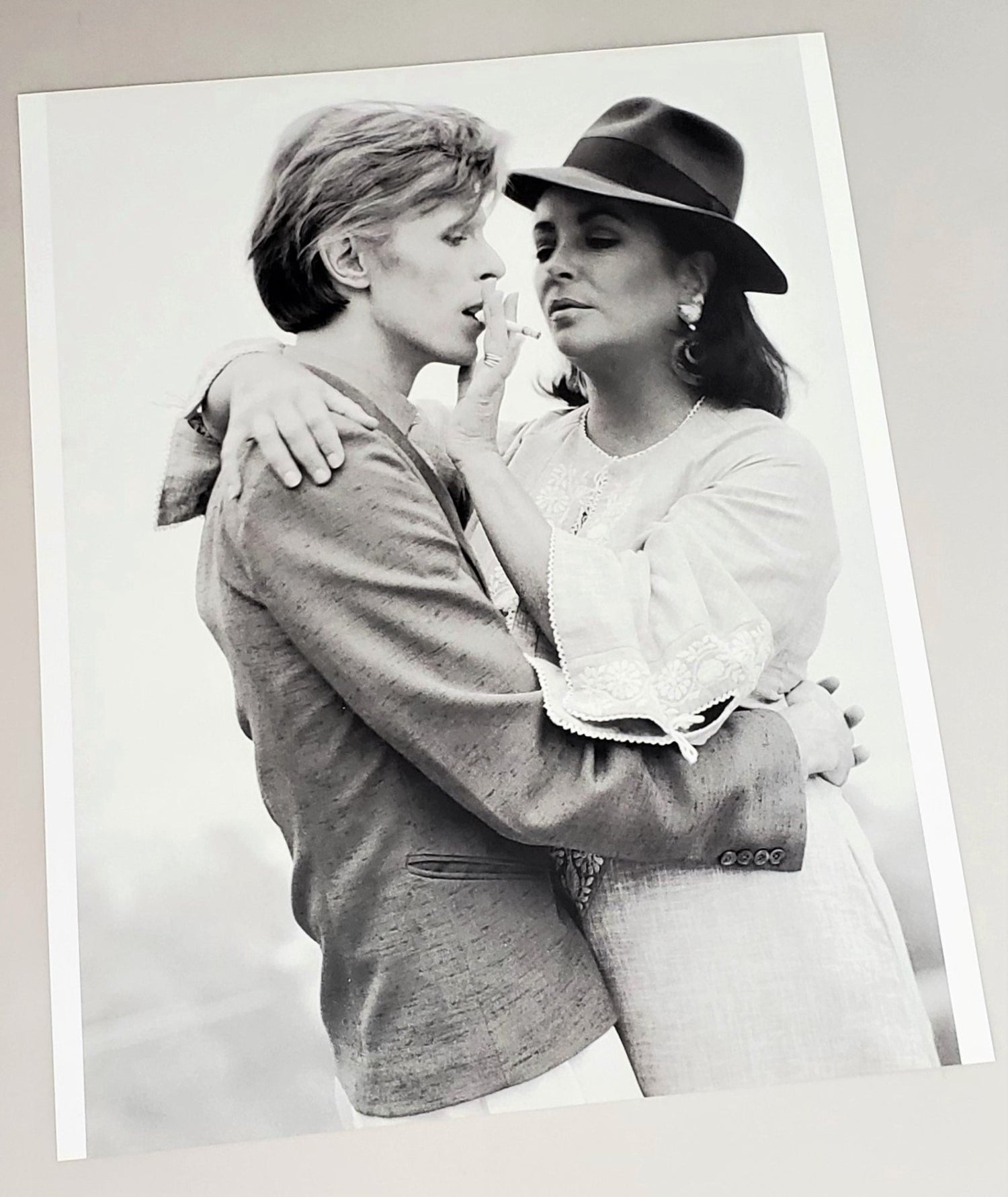 Photograph page of Bowie & Elizabeth Taylor in 1975 featured in 2010 David Bowie hardcover book by Jeff Hudson