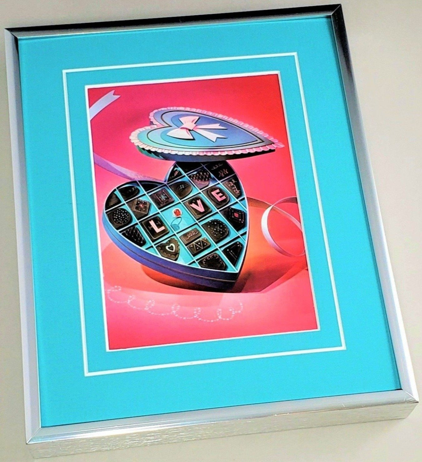 Framed Tiffany & Co. holiday photograph page for Valentines 2015 featured in 2018 Windows at Tiffany and Co.