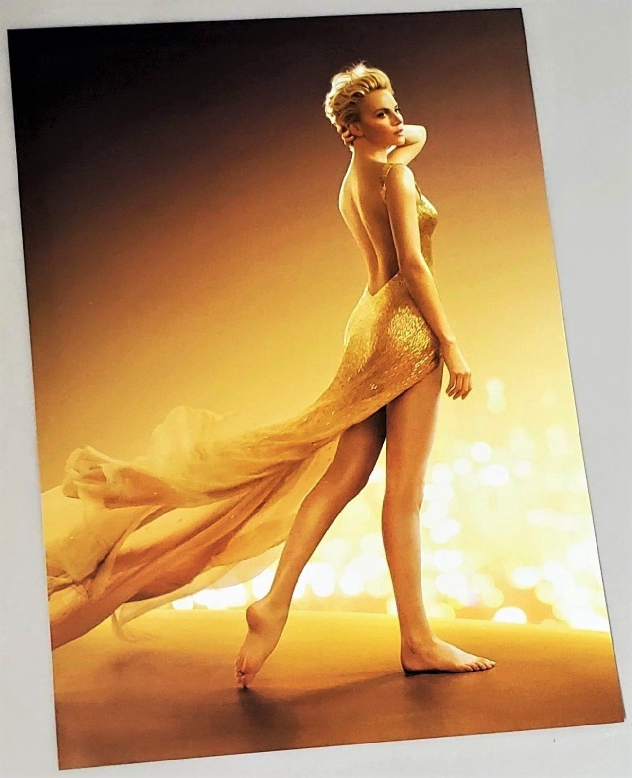 Glossy Charlize Theron for J'adore photograph advertisement page featured in September 2016  Vogue magazine available in area51gallery