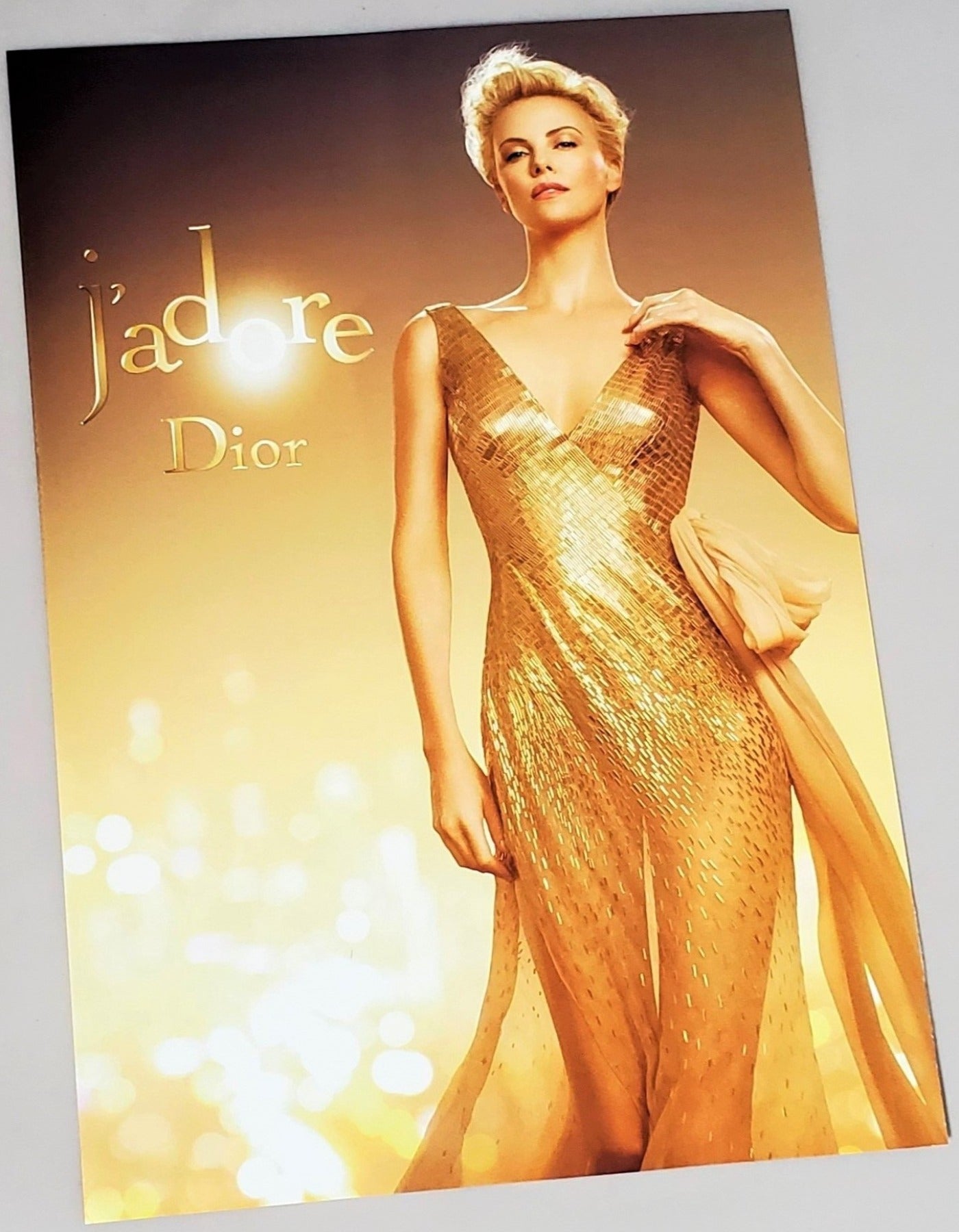 Glossy Charlize Theron for J'adore photograph advertisement page featured in September 2016 Vogue magazine available in area51gallery